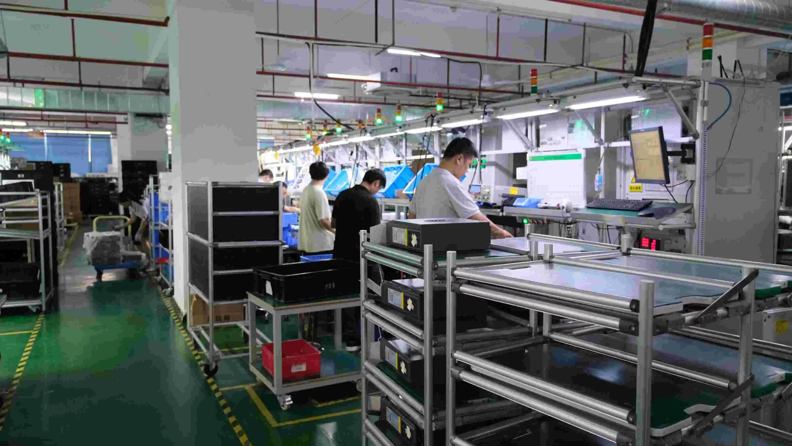 Engineer performing burn-in test on off grid inverter units